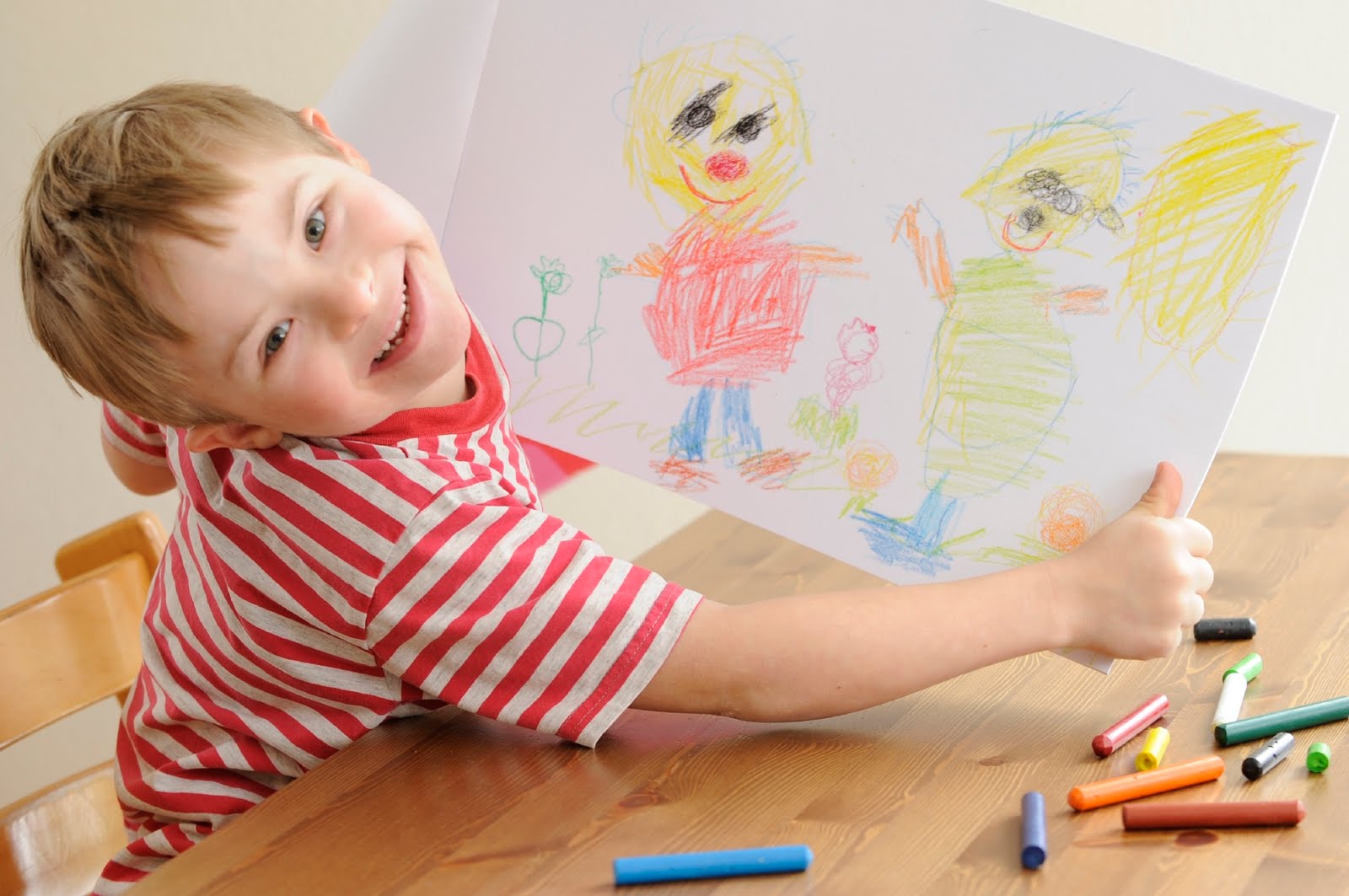 special needs child draws a picture
